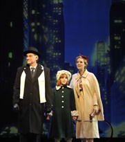 Gene Weygandt plays Daddy Warbucks, Caroline Heffernan plays Annie and Emily Rohm is Grace Farrell. Photo by Liz Lauren